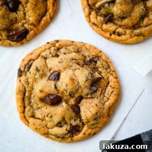 Jacques Torres Chocolate Chip Cookies with rich chocolate discs and a sprinkle of sea salt.