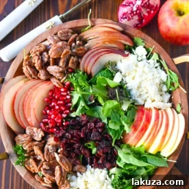 If you're looking for a beautiful, seasonal salad perfect for autumn, Fall, and Thanksgiving gatherings, this Honeycrisp Apple and Candied Pecan Salad is sure to impress! It has a combination of crisp fruits, creamy goat cheese, sweet and crunchy candied pecans, and a tangy homemade maple dressing.