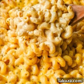 How to make a quick, easy, creamy, cheesy homemade mac and cheese recipe. All of the tips and tricks for making a velvety cheese sauce that is completely smooth. You will love this easy mac and cheese recipe!