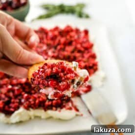 This Cranberry Jalapeno Cream Cheese Dip is a festive appetizer that is creamy, tart, a tad spicy, and sweet. This Cranberry Jalapeno Dip is made with fresh cranberry salsa atop cream cheese. It is the perfect holiday party appetizer!