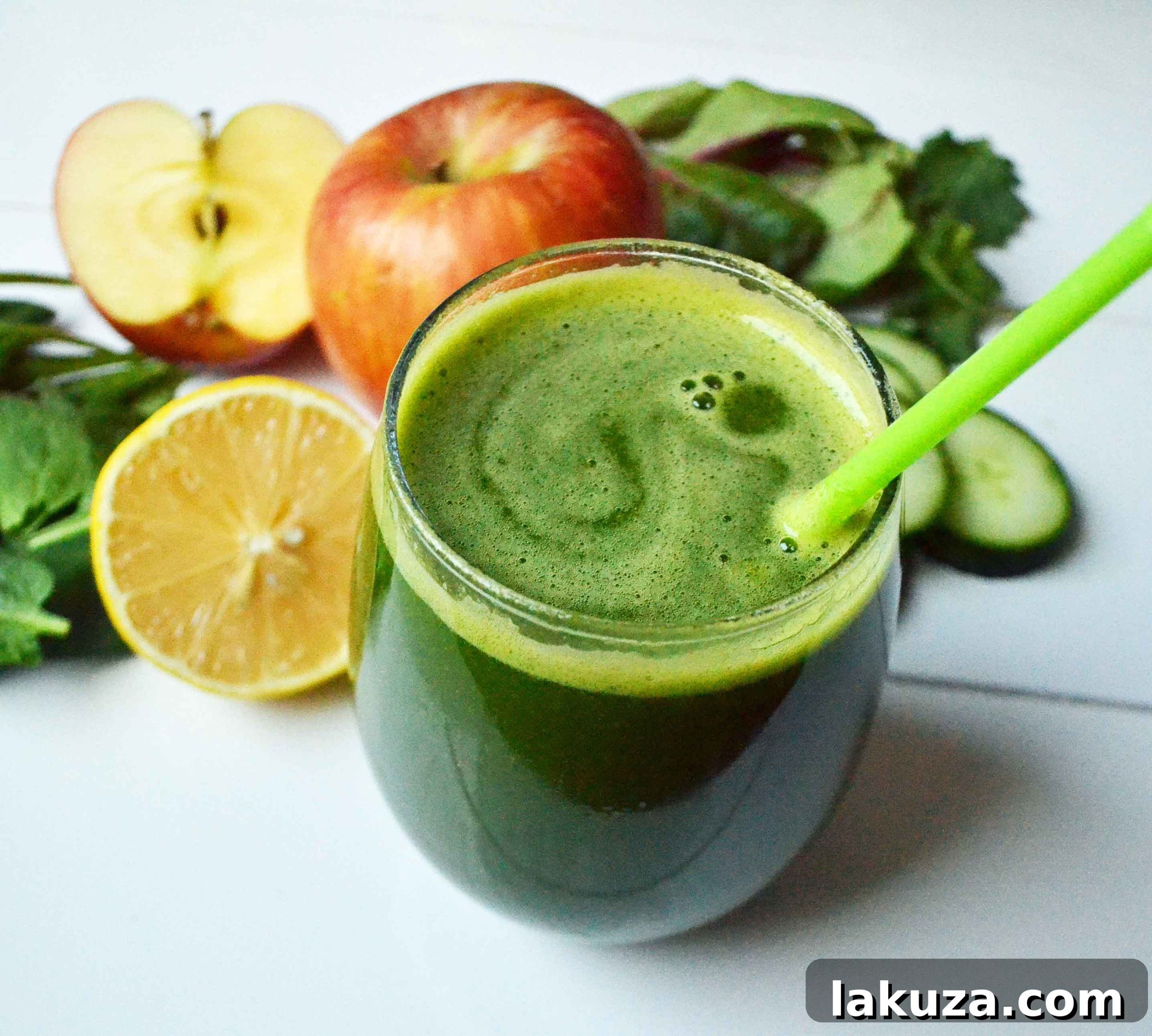 Youthful Glow Green Smoothie by Modern Honey. Healthy green smoothie made with whole foods -- spinach, apple, lemon, kale, cucumber, and banana.
