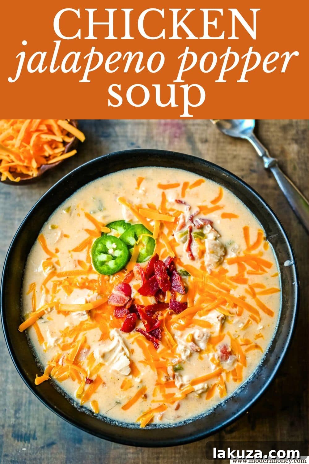Creamy Jalapeno Chicken Bliss 6 A cozy scene with a bowl of chicken jalapeño popper soup, a spoon, and a warm atmosphere, emphasizing comfort food.