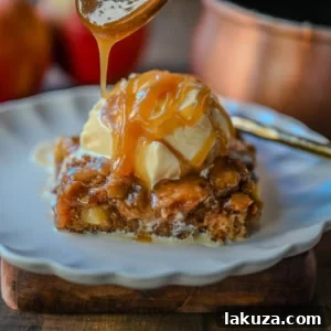 Apple Cake with Salted Caramel, a tender spiced apple cake drizzled with golden salted caramel, served in a square pan.
