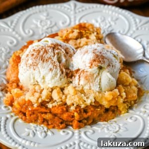 Creamy, rich spiced pumpkin cobbler with a sweet, buttery crumble. An easy Fall and Thanksgiving dessert.