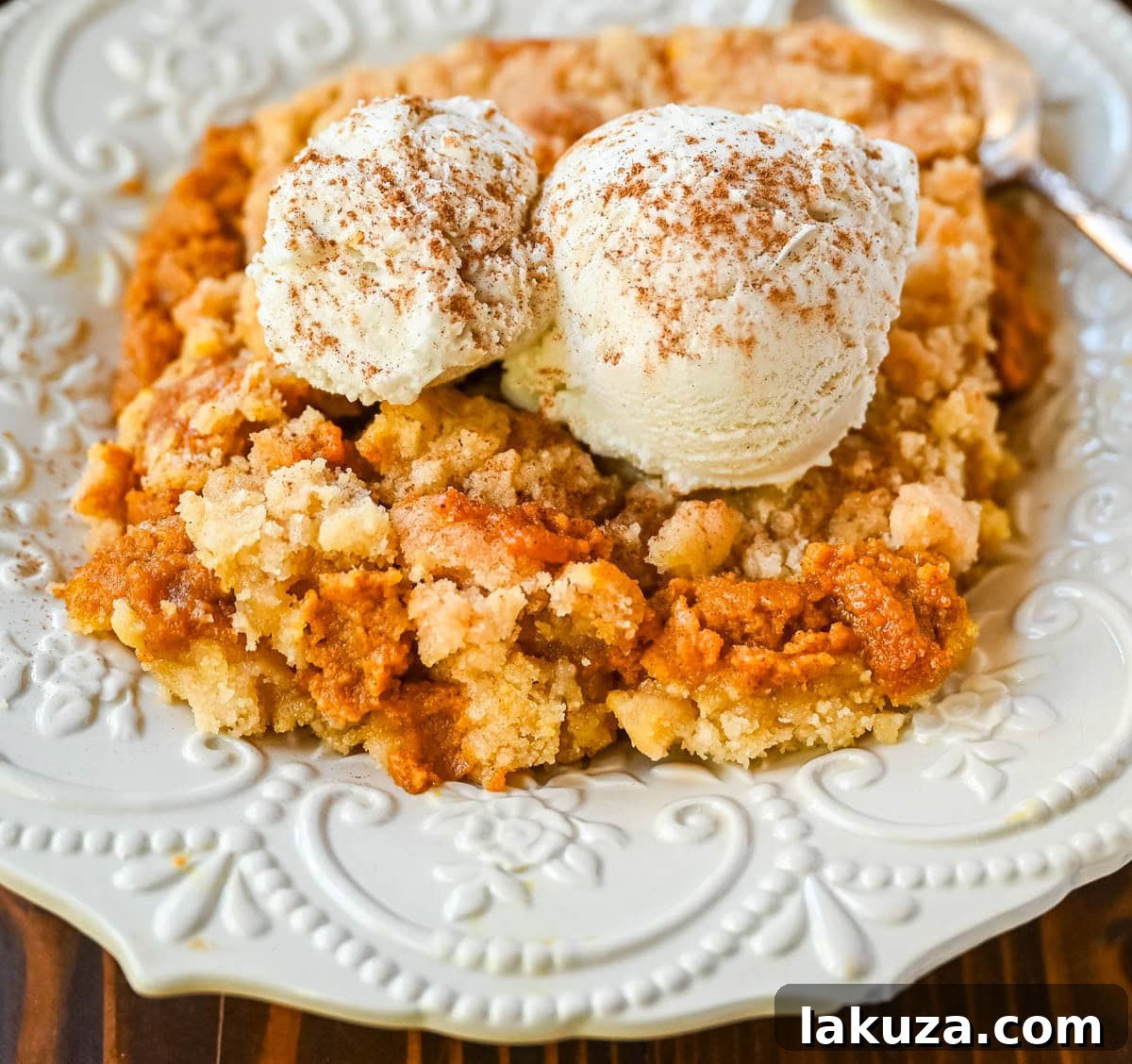 Full baking dish of freshly baked pumpkin cobbler, ready to be served.