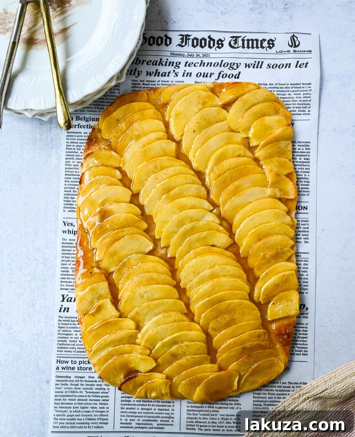 Classic French Apple Delight 6 A freshly baked French Apple Tart, glistening with apricot glaze, cooling on a rack.