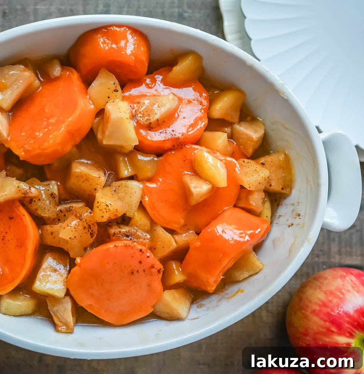Tender sweet potatoes and apples layered in a silky butter and sugar sauce that thickens into a shiny glaze as it bakes. A timeless fall side dish everyone will love.