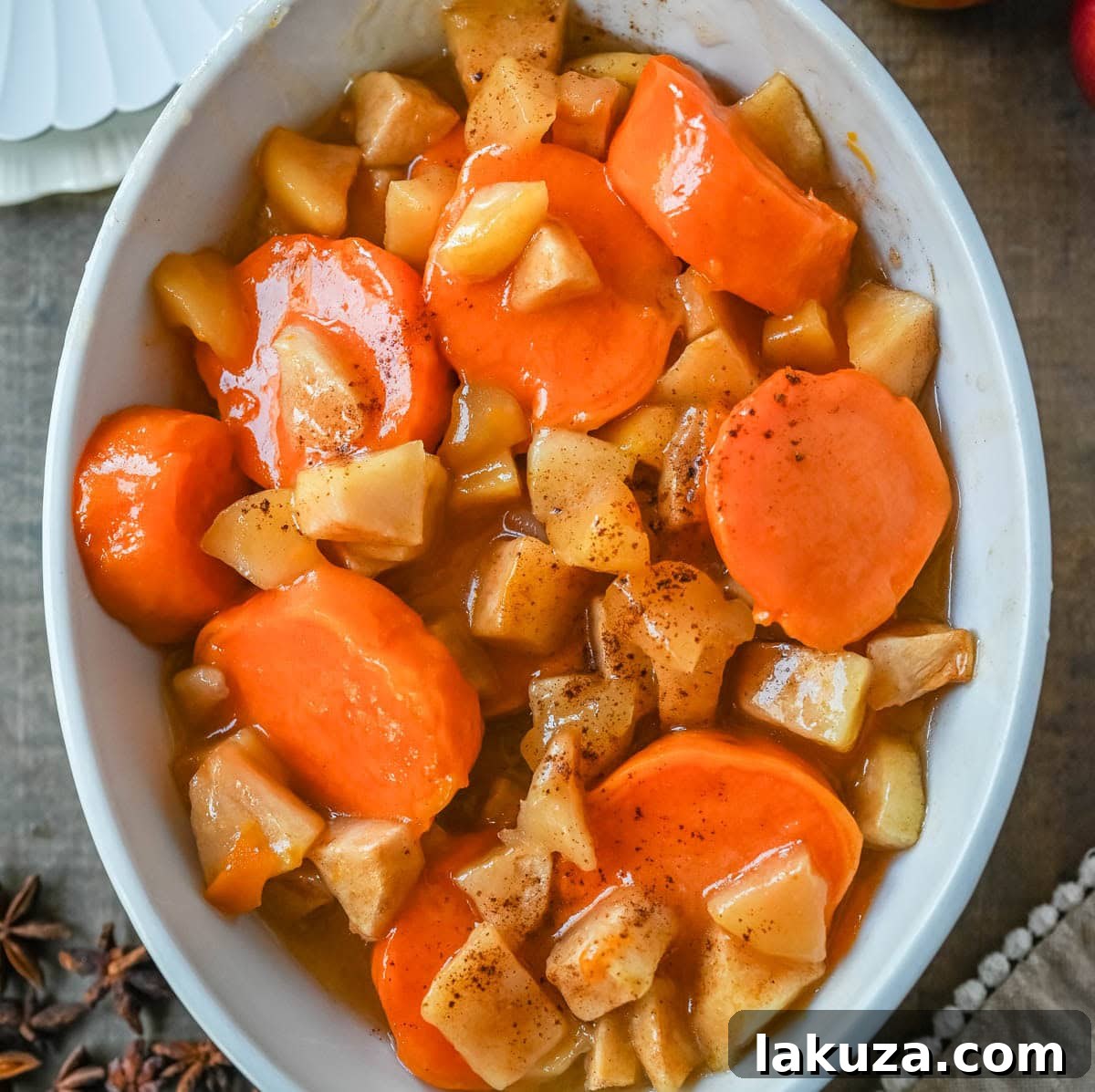 This Sweet Potatoes and Apples Recipe is mad with tender sweet potatoes and apples layered in a silky golden butter and sugar sauce that thickens into a glaze as it bakes. A timeless fall side dish everyone will love.