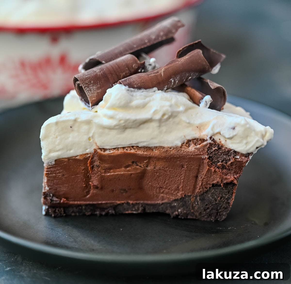 A top-down view of a beautifully prepared No Bake Chocolate Cream Pie, garnished with chocolate shavings, ready to be served.