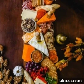 Festive Charcuterie Board perfect to celebrate Thanksgiving or Friendsgiving with friends and family. How to pick out the perfect meats, cheeses, fruits, jams, crackers, and dips for your Fall charcuterie spread. Tips and tricks for making the best charcuterie board.