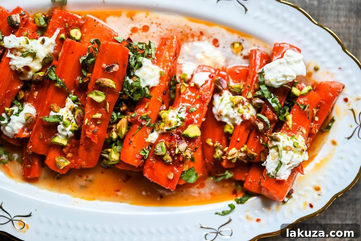 Sweet and Spicy Roasted Carrots are the perfect combination of sweetness and a warm kick from the Calabrian chili paste. Topped with creamy burrata, crunchy pistachios, and fresh basil, this side dish feels restaurant-worthy but is incredibly easy to make at home. The best roasted carrot side dish recipe!