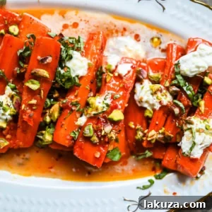 Sweet and Spicy Roasted Carrots are the perfect combination of sweetness and a warm kick from the Calabrian chili paste. Topped with creamy burrata, crunchy pistachios, and fresh basil, this side dish feels restaurant-worthy but is incredibly easy to make at home. The best roasted carrot side dish recipe!