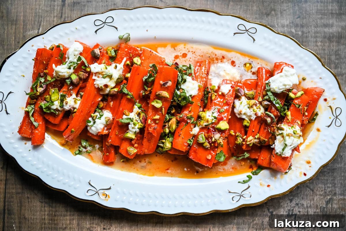 Sweet and Spicy Roasted Carrots are the perfect combination of sweetness and a warm kick from the Calabrian chili paste. Topped with creamy burrata, crunchy pistachios, and fresh basil, this side dish feels restaurant-worthy but is incredibly easy to make at home. The best roasted carrot side dish recipe!