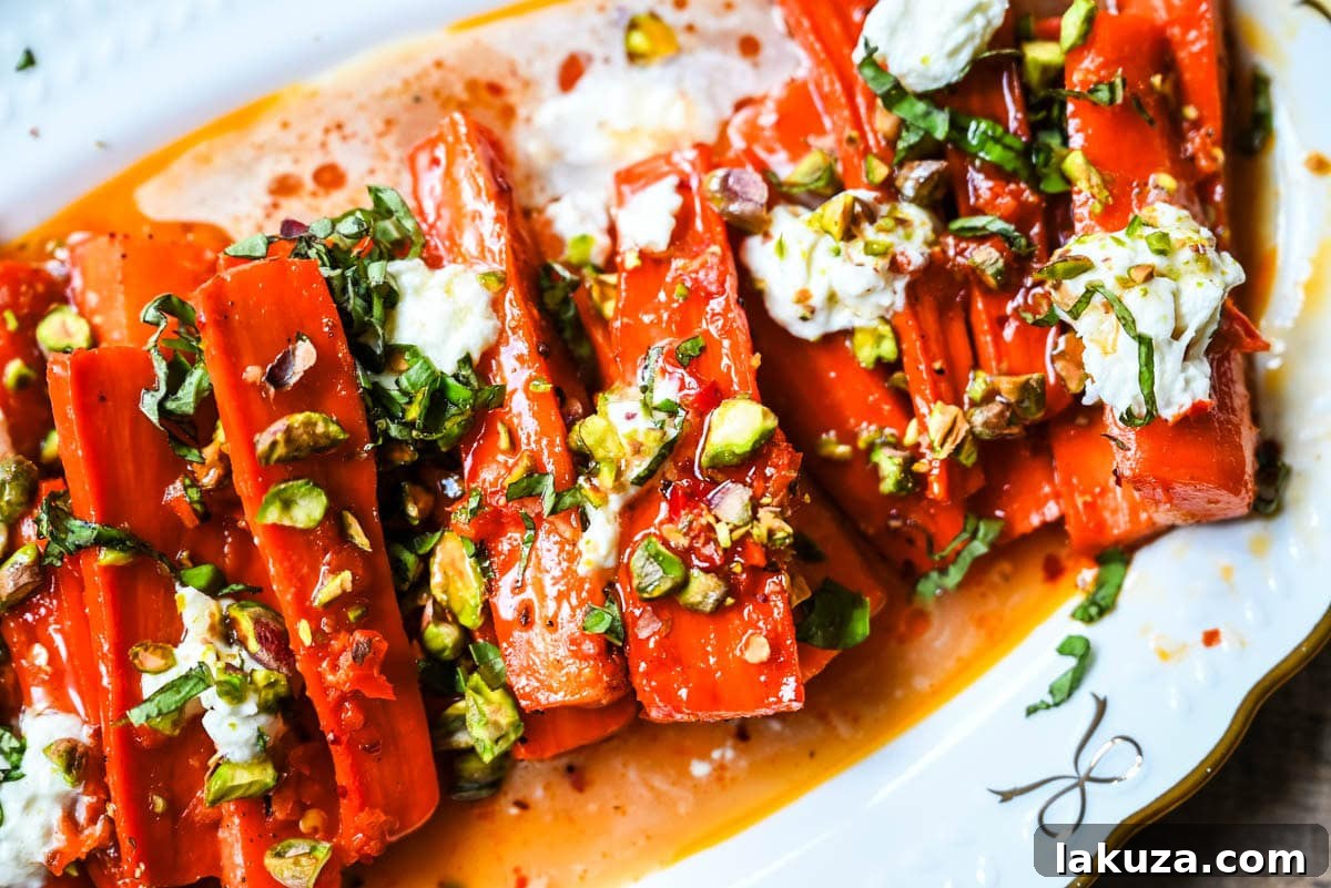 Sweet and Spicy Roasted Carrots are the perfect combination of sweetness and a warm kick from the Calabrian chili paste. Topped with creamy burrata, crunchy pistachios, and fresh basil, this side dish feels restaurant-worthy but is incredibly easy to make at home. The best roasted carrot side dish recipe!