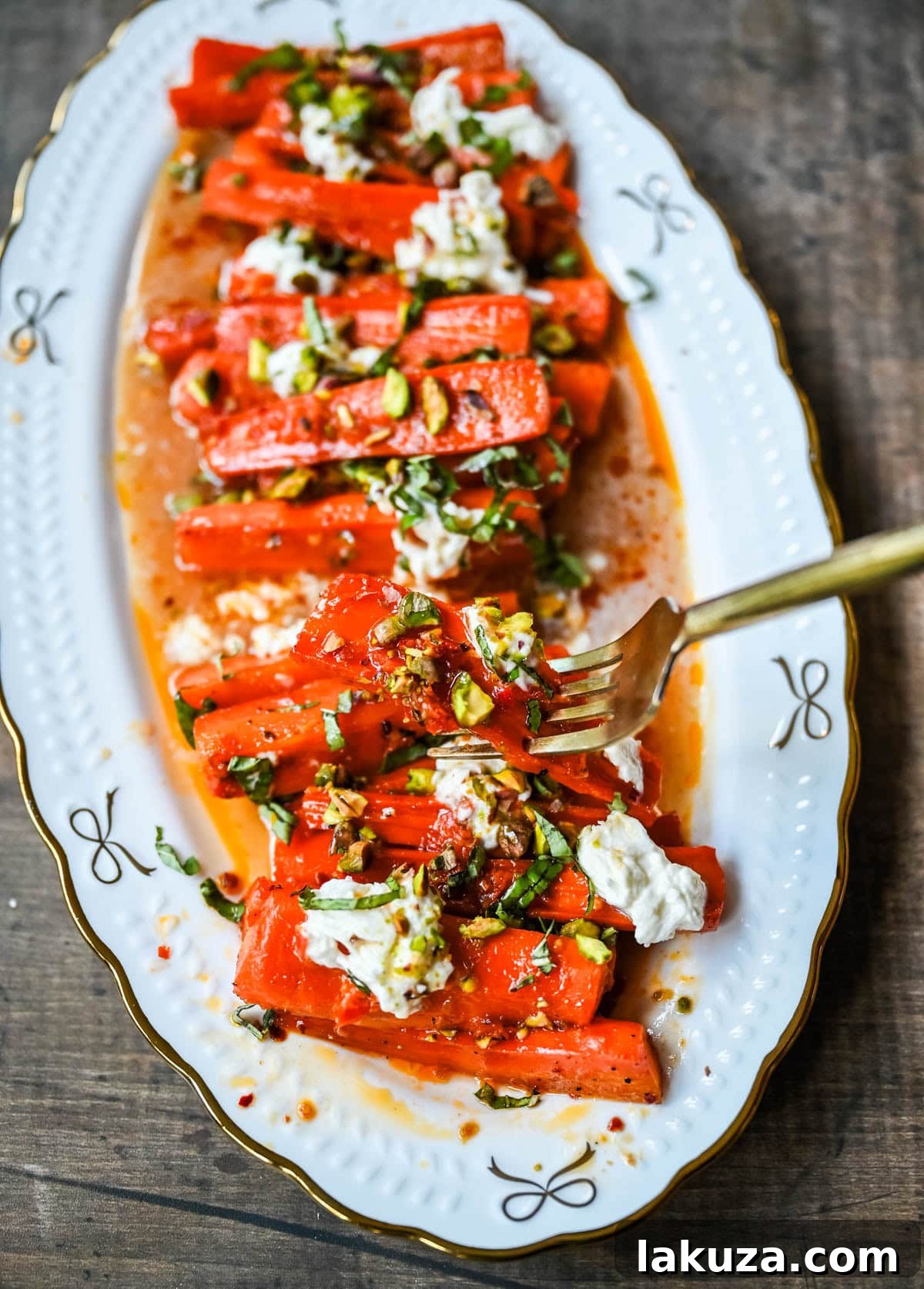 Sweet and Spicy Roasted Carrots are the perfect combination of sweetness and a warm kick from the Calabrian chili paste. Topped with creamy burrata, crunchy pistachios, and fresh basil, this side dish feels restaurant-worthy but is incredibly easy to make at home. The best roasted carrot side dish recipe!
