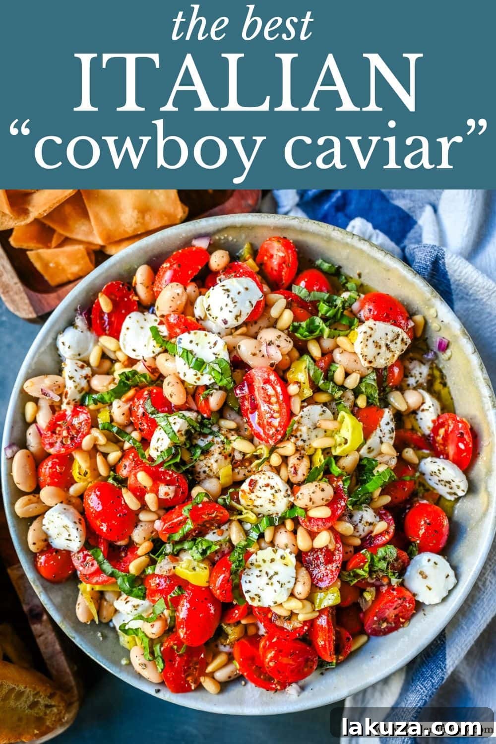 Italian Cowboy Caviar in a small bowl, garnished with basil and a spoon.