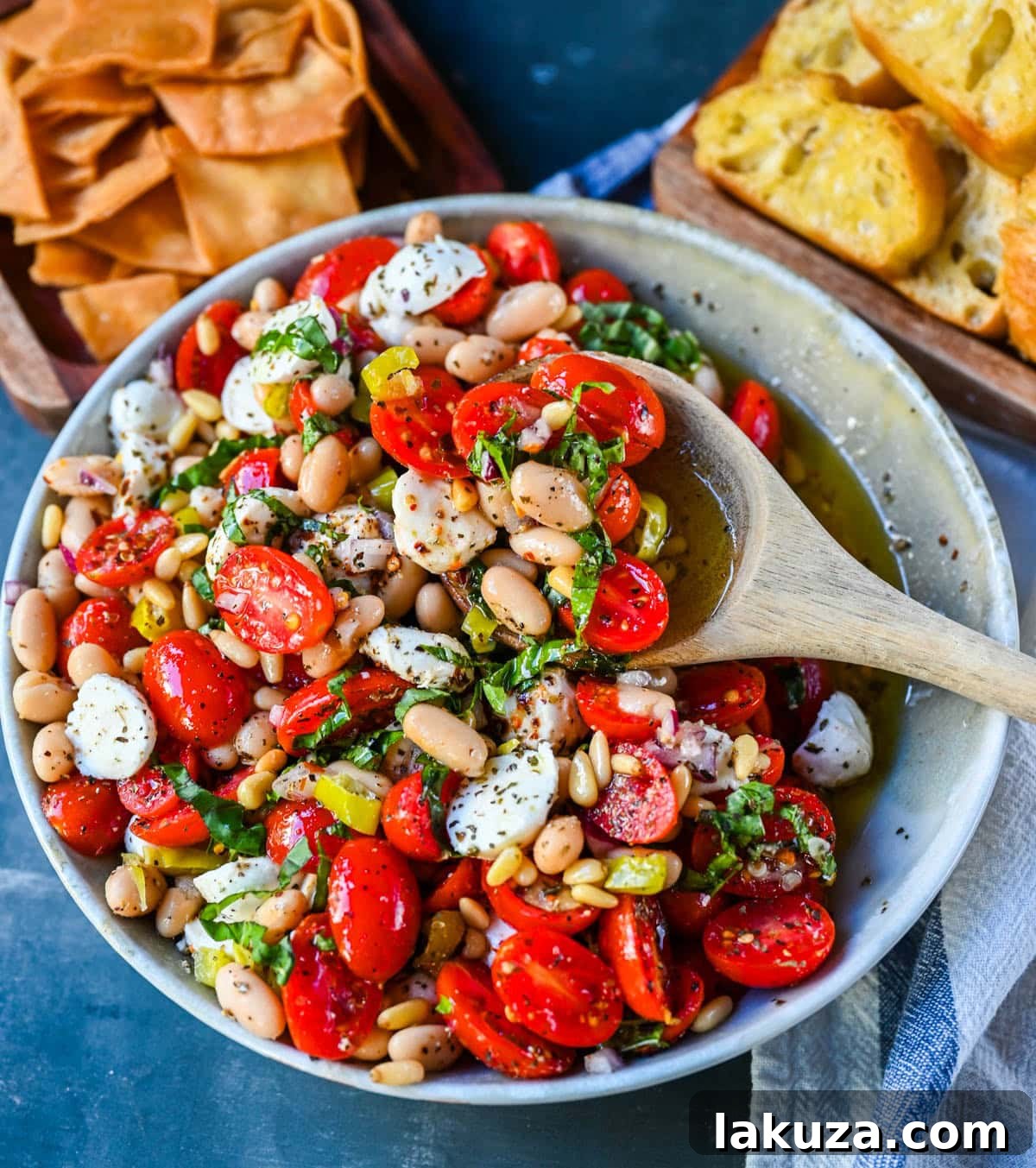 Serving Italian Cowboy Caviar in a bowl with toasted bread slices.