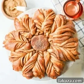 A festive Cinnamon Sugar Star Bread, a pull-apart bread that is perfectly soft, fluffy, and beautifully shaped like a star, filled with layers of butter, cinnamon, and sugar.