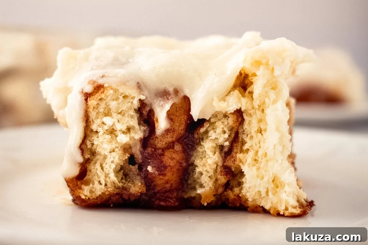 Hayley's Famous Cinnamon Rolls, showcasing warm, ooey-gooey, buttery brown sugar cinnamon rolls generously topped with luscious cream cheese icing, presented with step-by-step instructions for homemade perfection.