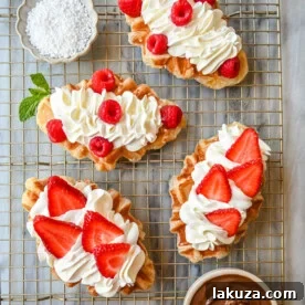 The famous croffle recipe, combining croissant dough baked in a waffle iron for a buttery, flaky, golden, and crispy waffle, ideal for breakfast or dessert with various toppings.