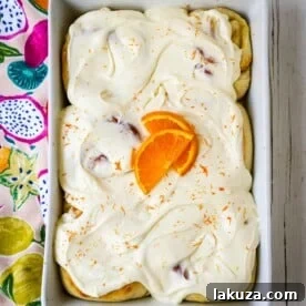 Homemade Orange Rolls with fresh orange zest and a sweet orange cream cheese frosting.