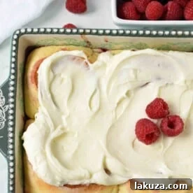 Homemade Raspberry Sweet Rolls with Cream Cheese Frosting, noted as the best homemade raspberry rolls.