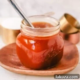 Homemade Buttermilk Syrup, a caramel syrup made with butter, sugar, Karo syrup, vanilla, and buttermilk, perfect for drizzling on pancakes, waffles, crepes, or aebleskivers.