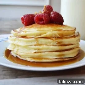 Sweet Cream Ricotta Pancakes, showcasing light, fluffy pancakes that melt in your mouth, a perfect indulgent breakfast or brunch.