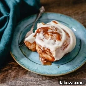 The famous, viral TikTok Cinnamon Rolls, enhanced with heavy cream, surpassing Cinnabon in ease and flavor, made with canned cinnamon rolls, a homemade buttery cinnamon drizzle, and cream cheese frosting.