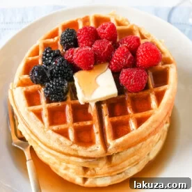 Homemade Buttermilk Waffles with crispy edges and chewy centers, making the perfect weekend breakfast.