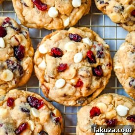 Soft, chewy, hearty oatmeal cranberry white chocolate chip cookies are made with tart dried cranberries, sweet white chocolate chips, and are always 5-star rated. The best Cranberry Oatmeal White Chocolate Chip Cookie recipe!