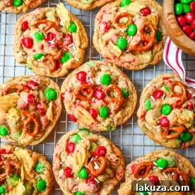 Get ready to bake the ultimate Christmas treat with these Christmas Kitchen Sink Cookies! Packed with holiday M&M's, pretzels, potato chips, sprinkles, and optional chocolate chips, these cookies bring together sweet, salty, and festive flavors in every bite. They're easy to make, fun to customize, and perfect for gifting, cookie swaps, and for your Christmas baking.