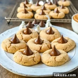 Easy Peanut Butter Blossoms. This popular soft and chewy peanut butter cookie with a Hershey's chocolate kiss in the center is the classic Christmas cookie. This recipe has been in my family for over 60 years and is the best peanut butter blossom recipe.