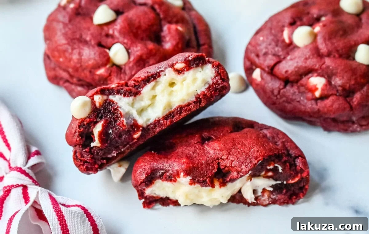 Cheesecake stuffed Red Velvet Cookies with white chocolate chips and a creamy cheesecake center are the perfect Christmas cookie. A vibrant red velvet cookie meets a creamy cheesecake center, with bursts of sweetness from white chocolate chips in every bite.