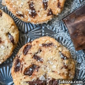 Salted chocolate chunk shortbread cookies are a twist on the classic chocolate chunk cookie, combining buttery, crumbly shortbread with rich chocolate chunks and a hint of flaky sea salt. These chocolate chip shortbread cookies are a perfect balance of sweet, salty, and savory flavors with a melt-in-your-mouth texture.