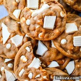 Ginger Molasses White Chocolate Chunk Cookies. These soft ginger molasses cookies with white chocolate chunks are a warm, spiced cookie studded with creamy white chocolate. Chewy centers, crisp edges, warm spiced flavor, with creamy white chocolate make it a quintessential Christmas cookie.