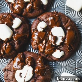 These Hot Cocoa Cookies feature a homemade chocolate cookie base, a gooey marshmallow topping, and a drizzle of melted chocolate for the perfect finishing touch. If you love peppermint, add crushed candy canes and a hint of peppermint extract for Peppermint Hot Cocoa Cookies.