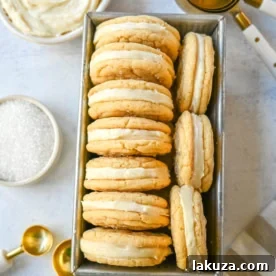 Sugar Sandwich Cookies with Cream Cheese Frosting are two soft and tender, buttery sugar cookies sandwiched with creamy and sweet cream cheese filling. These Homemade Sugar Cookie Oreos are soft, chewy and filled with the best cream cheese frosting.
