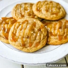 Salted Caramel Cookies Soft chewy caramel cookies with sea salt and drizzled with salted caramel. www.modernhoney.com #cookie #cookies #caramel #caramelcookie #saltedcaramel #seasaltcaramel