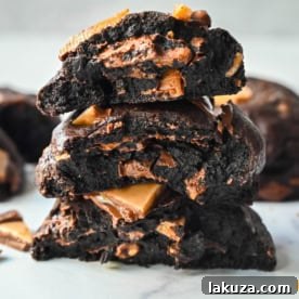 Rich, decadent, dark chocolate cookies filled with chocolate covered toffee chunks. These Levain Bakery Chocolate Toffee Cookies are the perfect chocolate toffee cookie. For extra rich chocolate flavor, add a touch of espresso powder to make Levain Bakery Coffee Toffee Cookies.