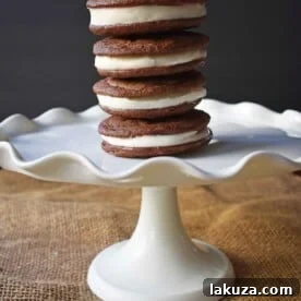 Homemade Oreo Cookies by Modern Honey. Rich Chocolate Cookies filled with Sweet Buttercream Filling. It's Oreos cookies but so much better.