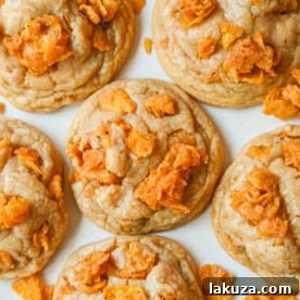 These Cornflake Crack Cookies are buttery, chewy, crispy cookies with toffee caramel notes thanks to homemade cornflake crack in and on top of the cookies. These sweet and salty cookies are always a hit!
