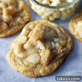 White Chocolate Macadamia Nut Cookies. Soft chewy white chocolate macadamia nut cookies are a sweet, buttery cookie and are always a crowd pleaser! www.modernhoney.com #whitechocolate #whitechocolatecookies #whitechocolatemacadamia #whitechocolatemacadamianutcookies #cookies #cookierecipe