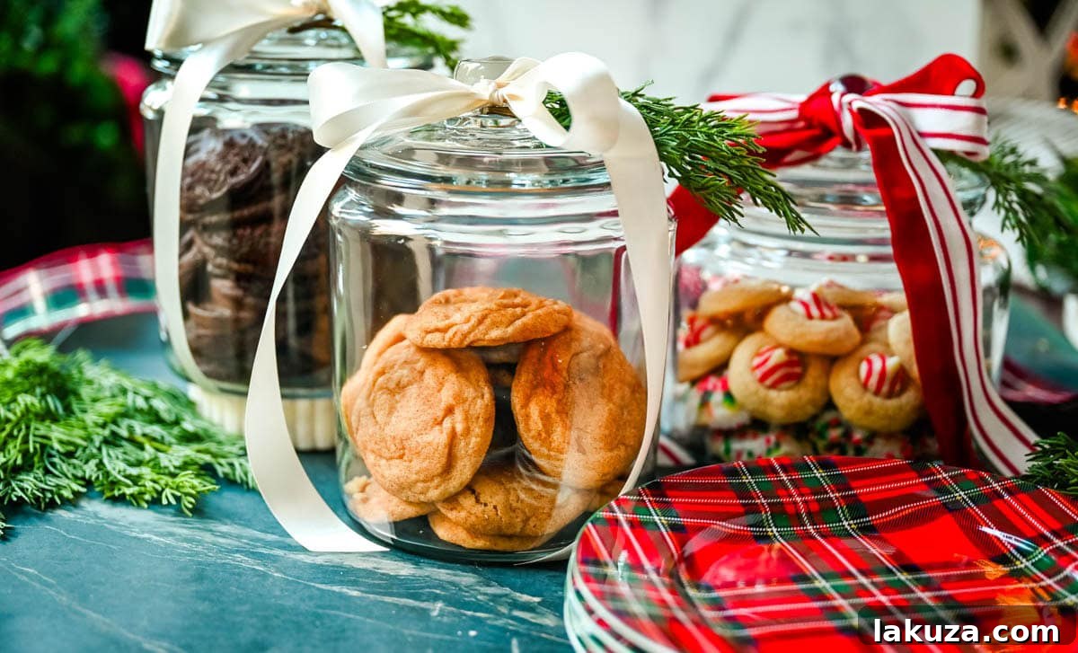 Christmas Cookie Jars. Christmas cookies in glass jars with ribbon.