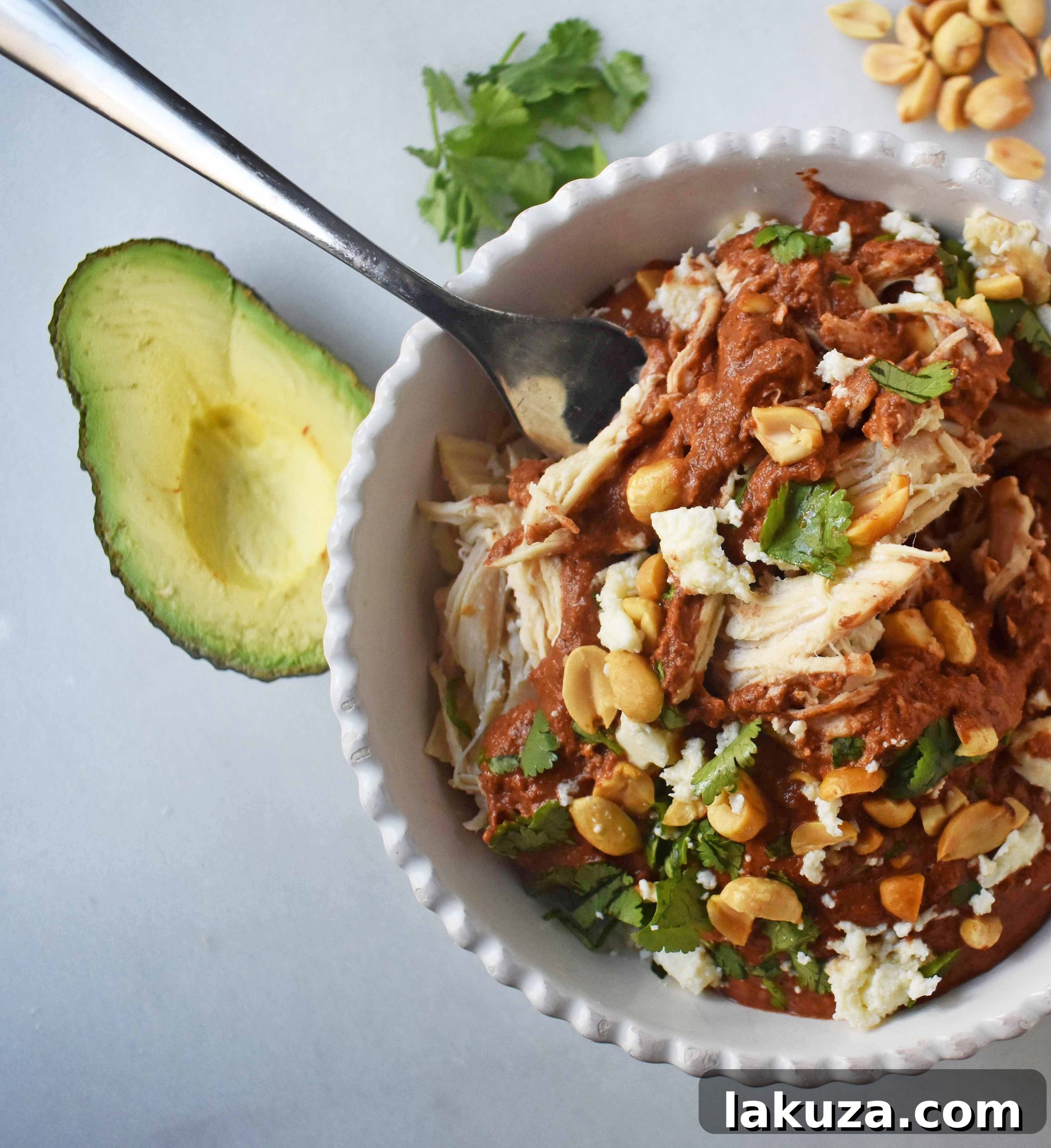 Crockpot Mexican Chicken Mole. Rich mole made easy in a slow cooker. Tender chicken covered in a rich, spiced, flavorful mole sauce. Can be made into chicken mole tacos by placing inside corn tortillas and topping with queso fresco, cilantro, white onion, and avocado. An easy crockpot dinner!