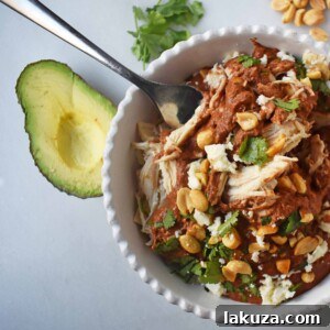 Crockpot Mexican Chicken Mole. Rich mole made easy in a slow cooker. Tender chicken covered in a rich, spiced, flavorful mole sauce. Can be made into chicken mole tacos by placing inside corn tortillas and topping with queso fresco, cilantro, white onion, and avocado. An easy crockpot dinner!