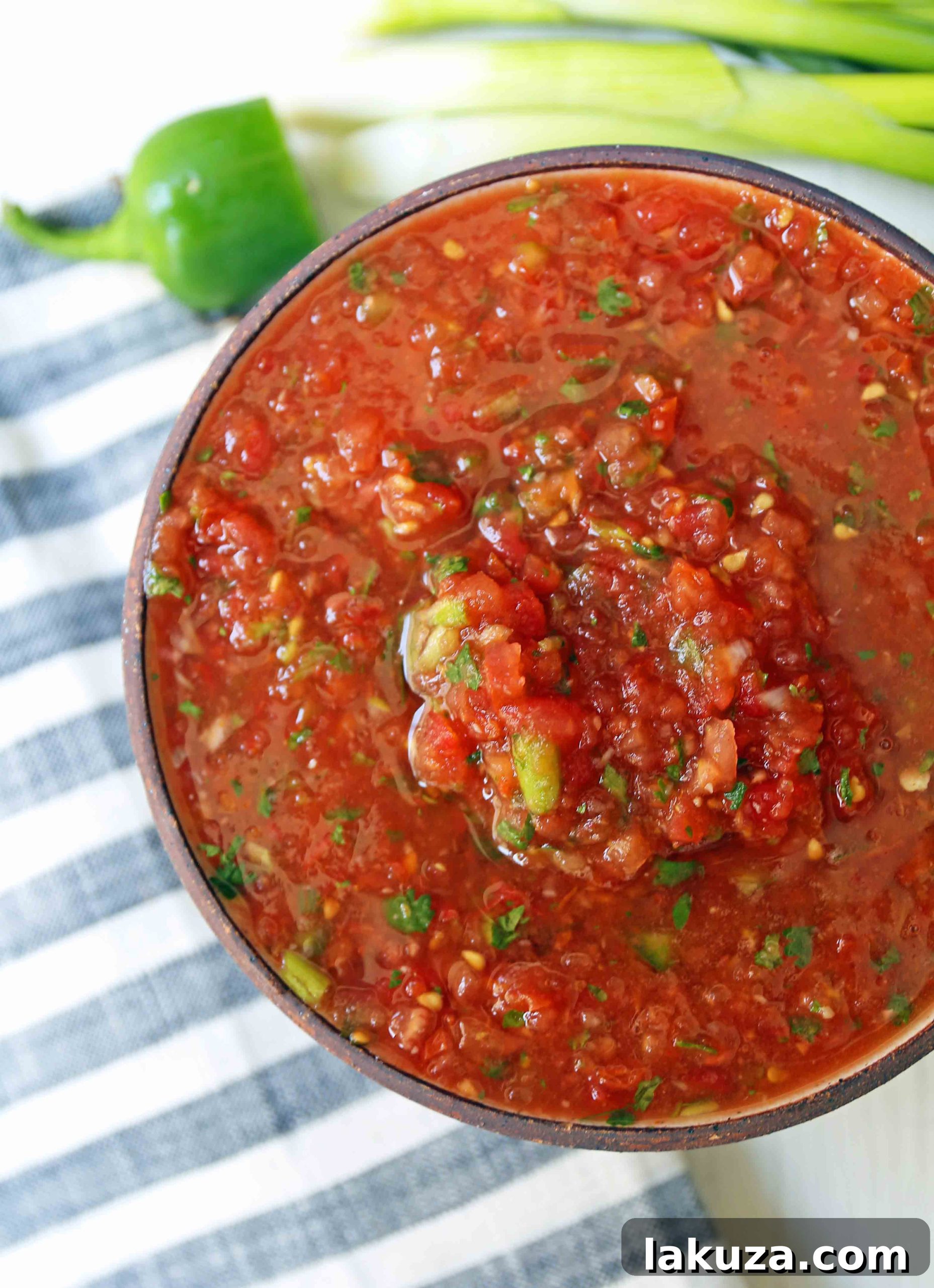 Homemade Restaurant Style Salsa. Fresh salsa made with fresh tomatoes, cilantro, green onion, jalapeno, and a secret ingredient! www.modernhoney.com