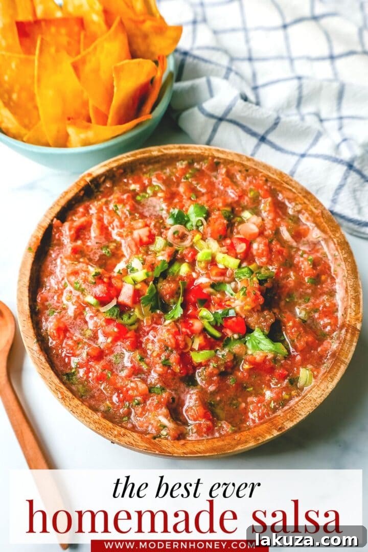 A vibrant bowl of homemade restaurant-style salsa, ready to be served.