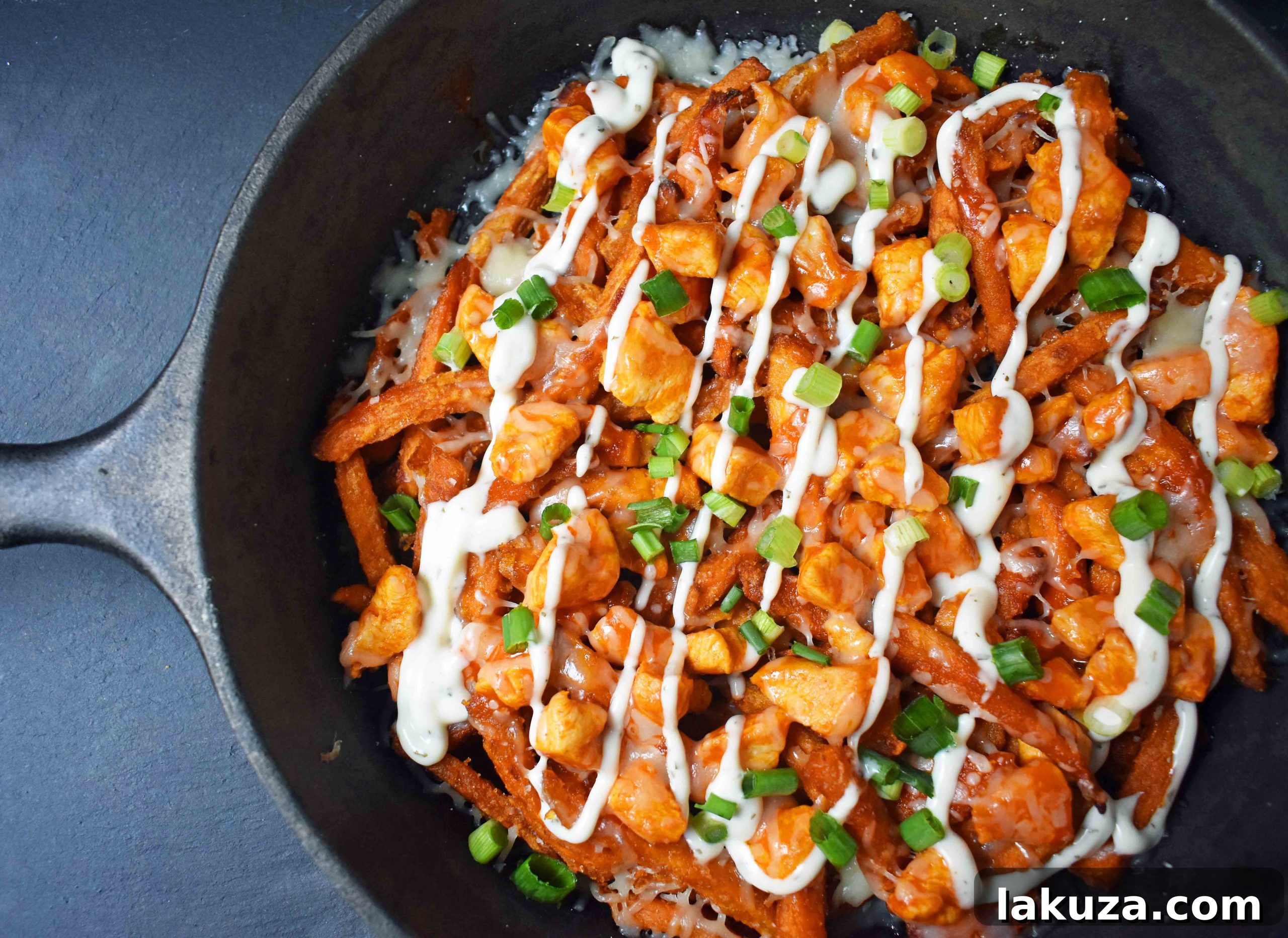 Buffalo Chicken Loaded Sweet Potato Fries 2 Ultimate Buffalo Chicken Sweet Potato Fries. Crispy sweet potato fries piled high with spicy buffalo chicken, melted cheese, green onions, and a cool ranch dressing drizzle. Perfect for game day!