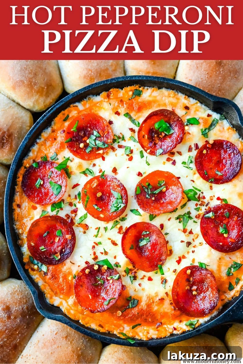 A beautifully presented Pepperoni Pizza Dip in a cast iron skillet, garnished with basil, ready for sharing at a gathering.